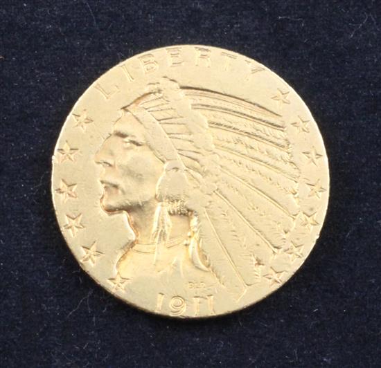 A United States 1911 $5 gold coin,